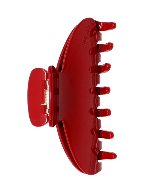 Red hair clip on a white background