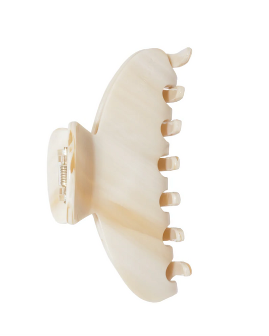 Beige hair clip on a white background
