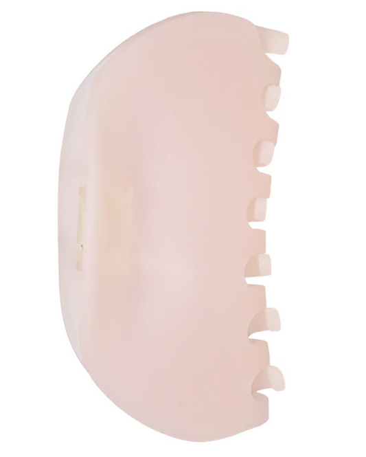 Beige hair clip on a white background