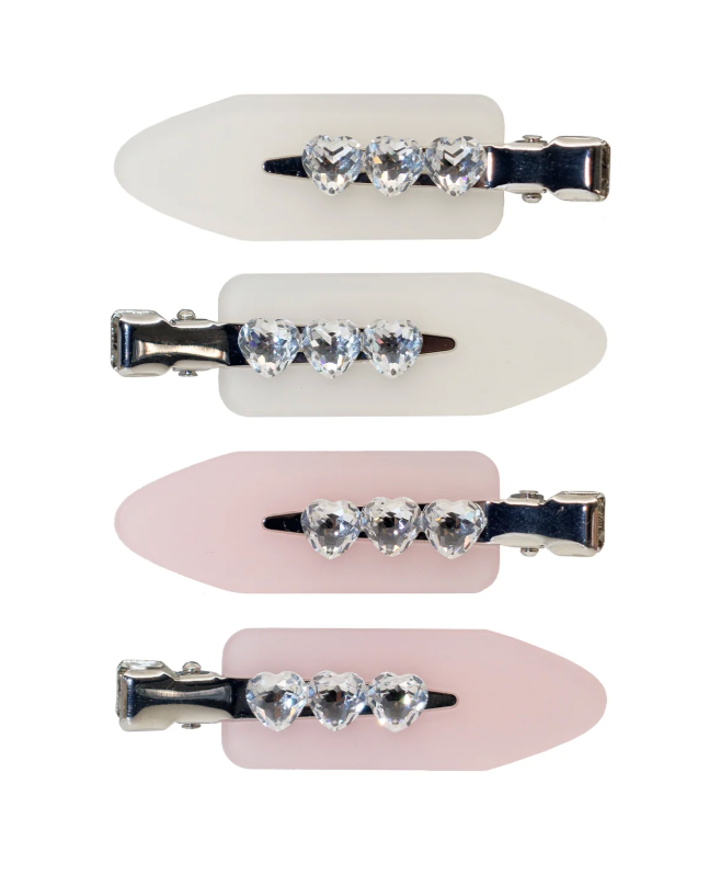 Set of four hair clips with crystal embellishments on a white background
