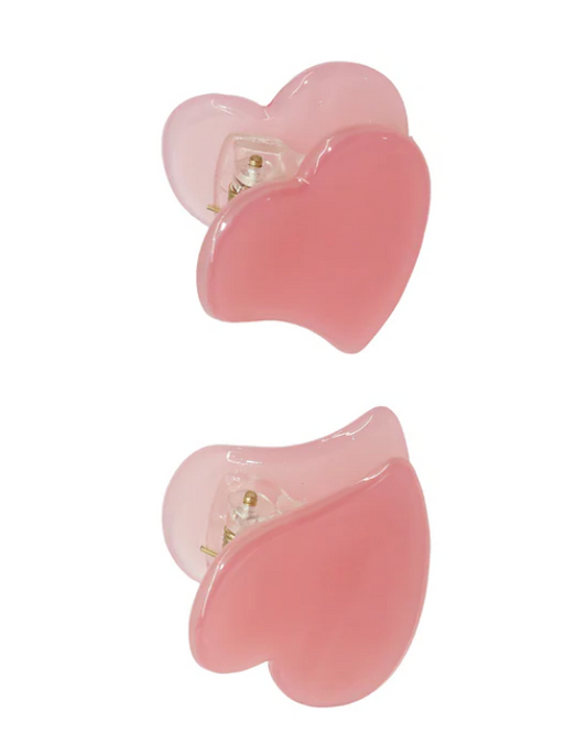 Pair of pink flower-shaped earrings on a white background