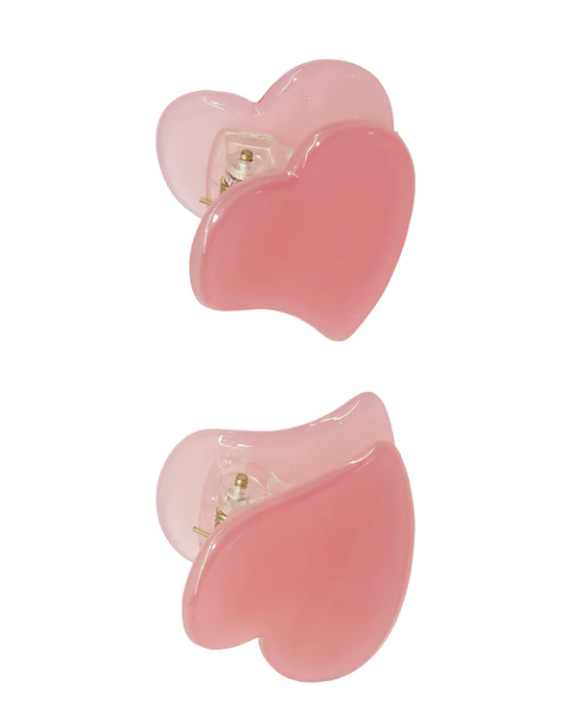 Pair of pink flower-shaped earrings on a white background