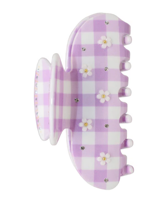 Purple checkered hair clip with floral designs on a white background