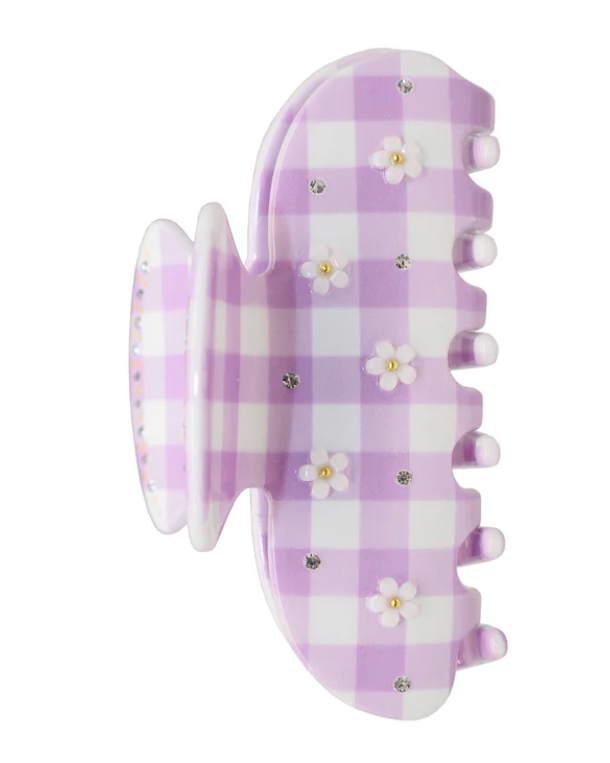 Purple checkered hair clip with floral designs on a white background