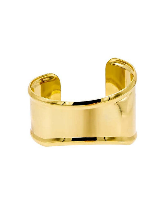A gold-plated, indented, and curved wide bangle bracelet with a reflective surface.
