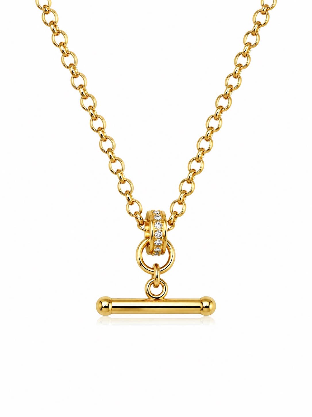 A gold chain necklace with a toggle bar pendant, featuring a small ring of clear stones on the clasp, set against a plain white background.