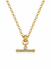 A gold chain necklace with a toggle bar pendant, featuring a small ring of clear stones on the clasp, set against a plain white background.