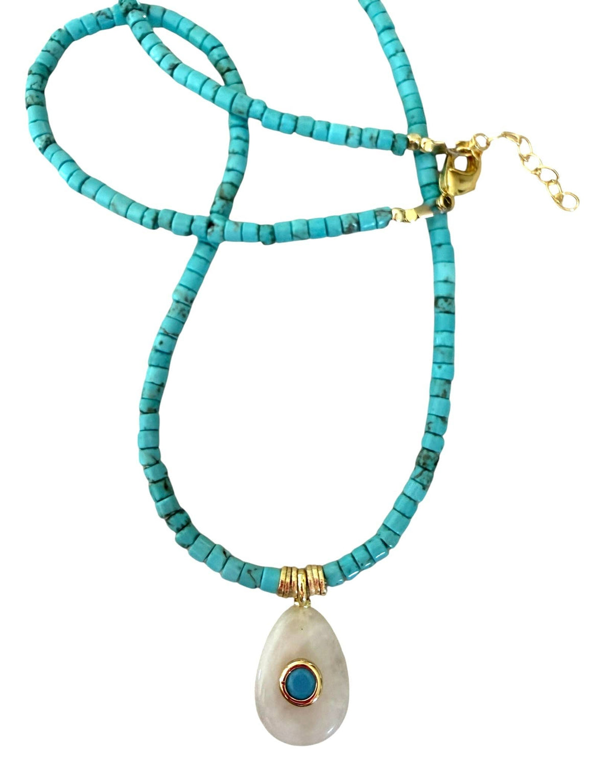 Turquoise beaded necklace with a white pendant featuring a blue stone on a white background
