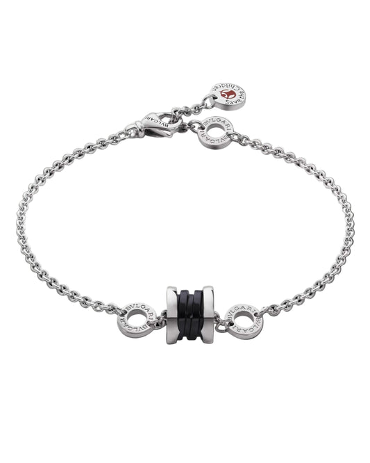 Silver bracelet with decorative elements on a black background