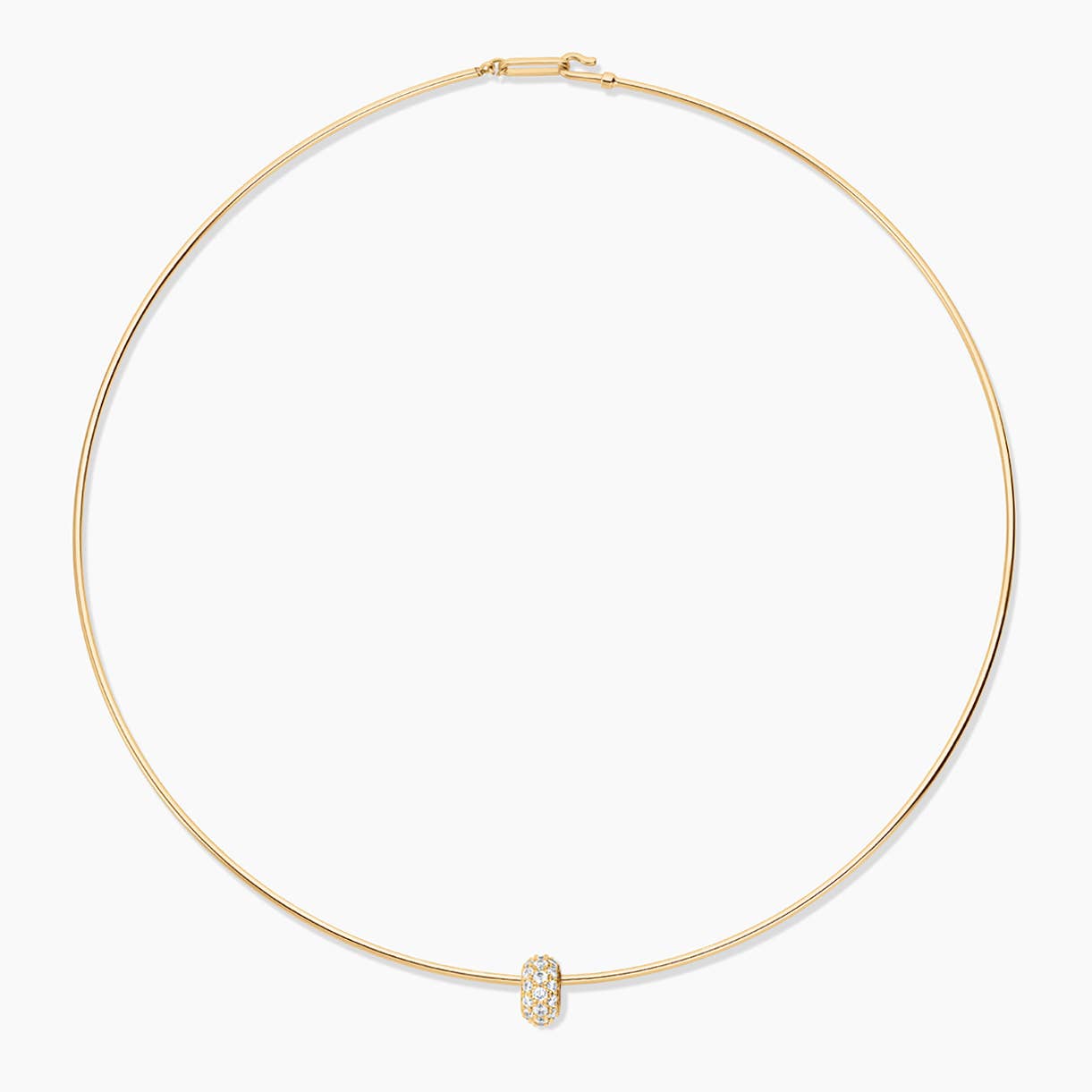 Gold necklace with a small pendant on a white background