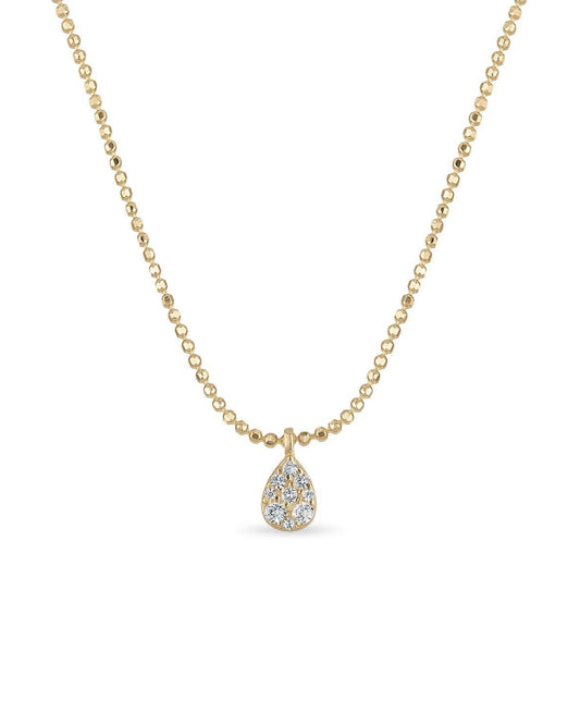 Gold necklace with a teardrop pendant on a white background