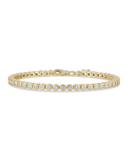 Gold bracelet with diamonds on a white background
