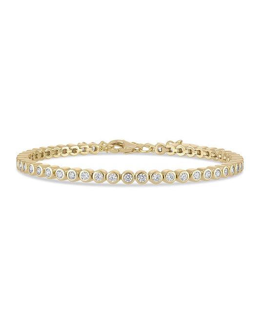 Gold bracelet with diamonds on a white background