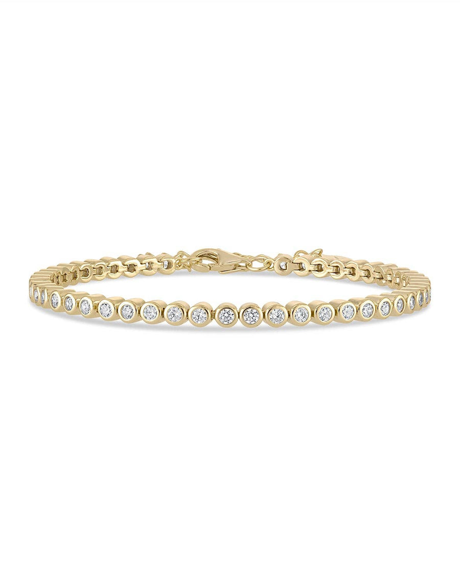 Gold bracelet with diamonds on a white background