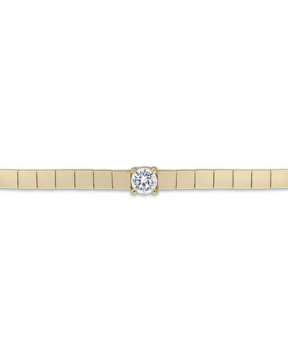 Gold bracelet with a diamond on a white background
