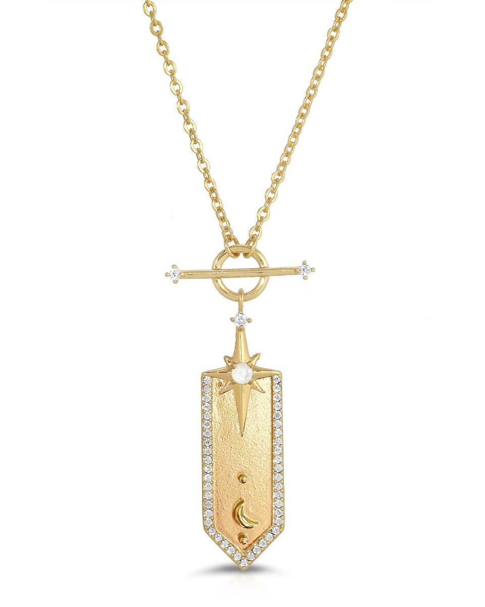 Gold necklace with a detailed pendant on a white background
