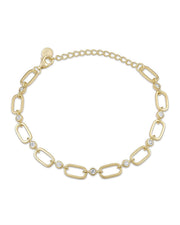 Gold bracelet with interlocking links and small crystals on a white background