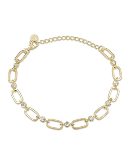Gold bracelet with interlocking links and small crystals on a white background