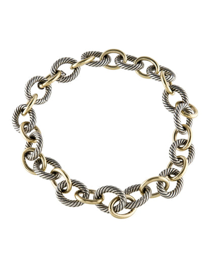 Gold and silver chain necklace on a white background