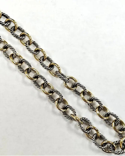 Gold and silver chain on a white background