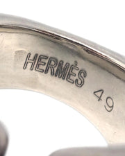 Close-up of a silver Hermès ring with size 49 engraving on a white background