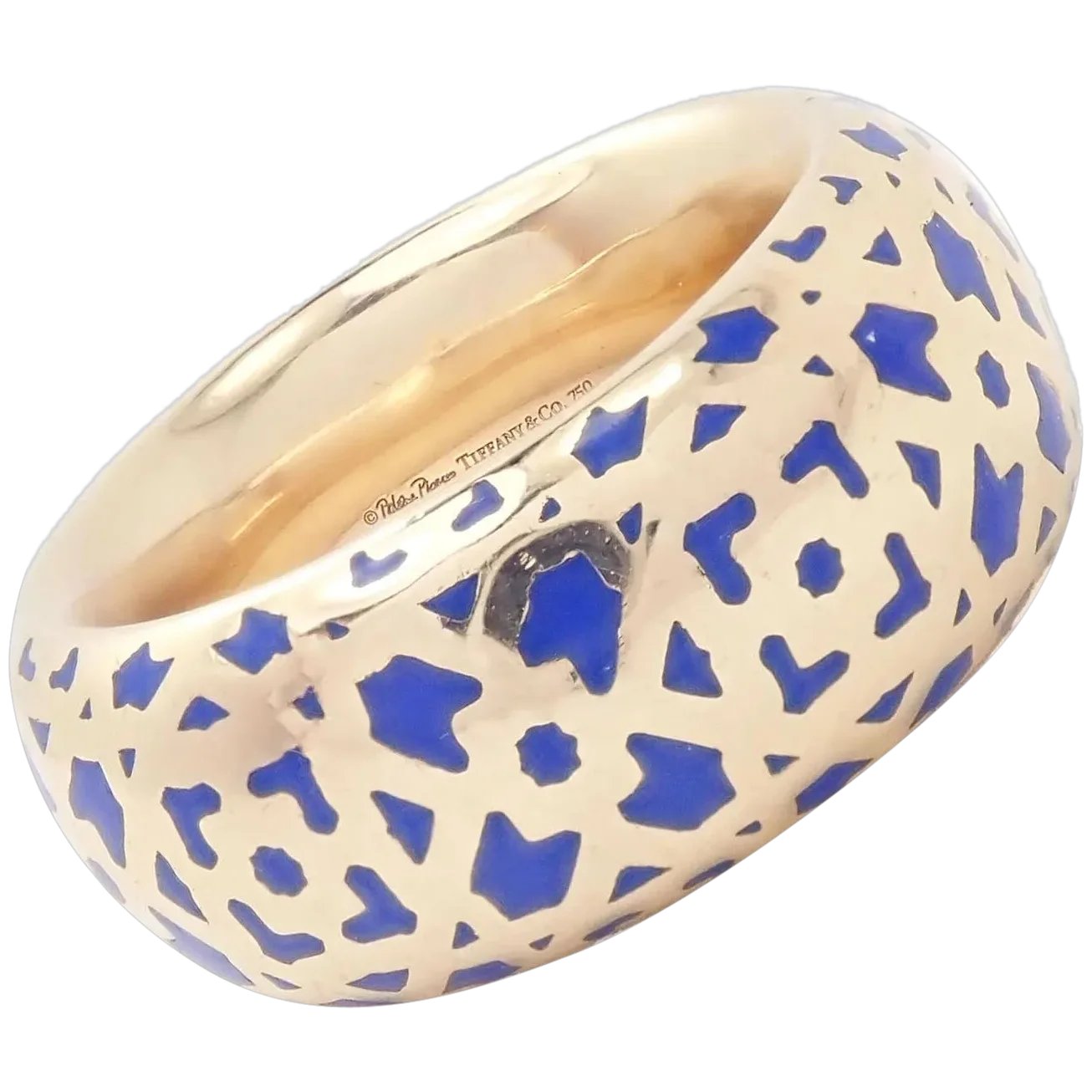 Gold ring with blue geometric pattern on a white background