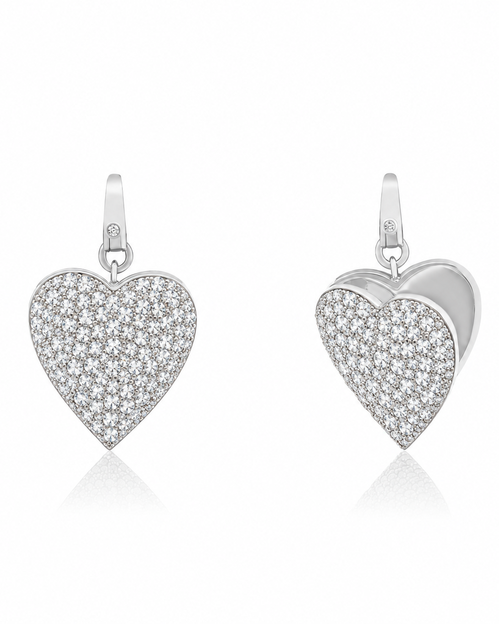 A silver heart-shaped locket, front and back view, paved with small clear stones, shown from the front and side on a white background.