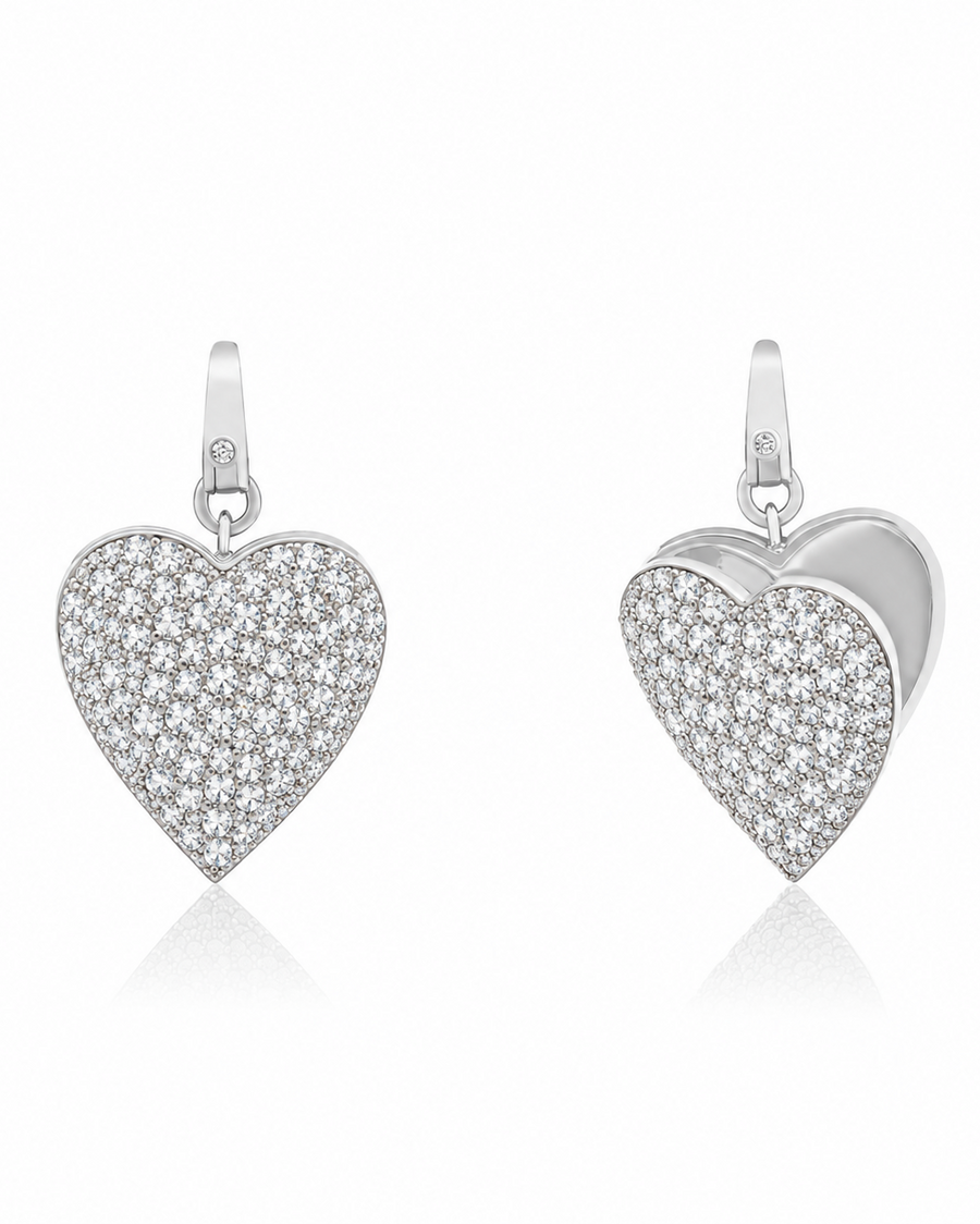 A silver heart-shaped locket, front and back view, paved with small clear stones, shown from the front and side on a white background.