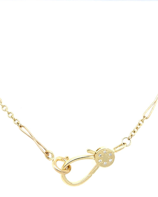 Gold necklace with a unique clasp design on a white background