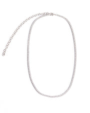 The KAYLA Tennis Necklace from Dylan James Jewelry, crafted with shimmering cubic zirconia and an adjustable clasp, is elegantly arranged in an oval shape on a plain white background.