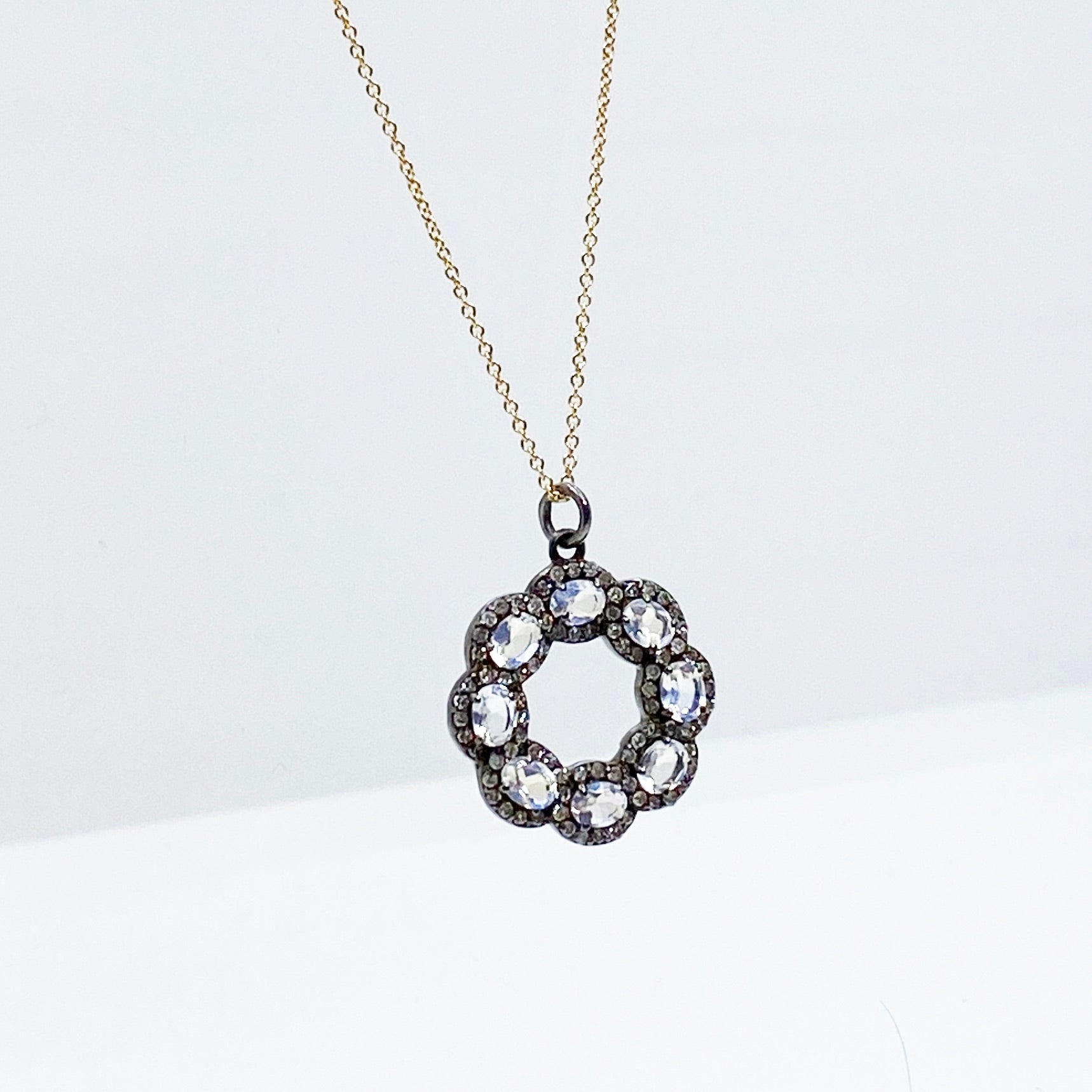 oxidized sterling silver diamond and moonstone pendant on yellow gold chain @dylanjamesjewelry.com