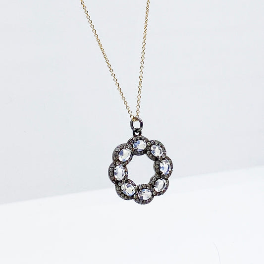 oxidized sterling silver diamond and moonstone pendant on yellow gold chain @dylanjamesjewelry.com