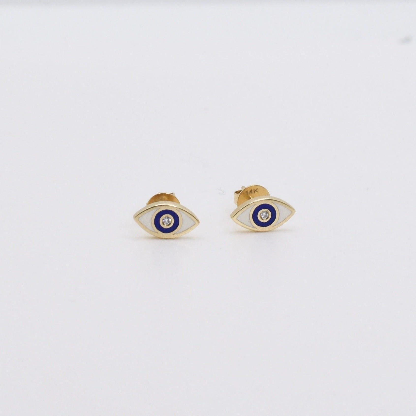 small yellow gold white and blue enamel diamond evil eye stud earrings  @dylanjamesjewelry.com