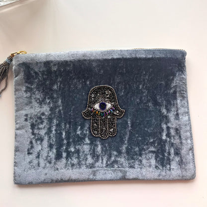 velour pouch with beaded hamsa  @dylanajmesjewelry.com