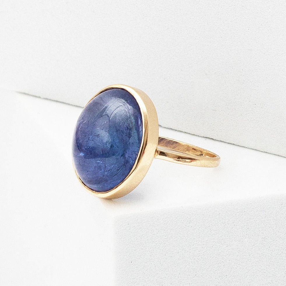 14kt yellow gold ring with large cabochon tanzanite ring  @dylanjamesjewelry.com